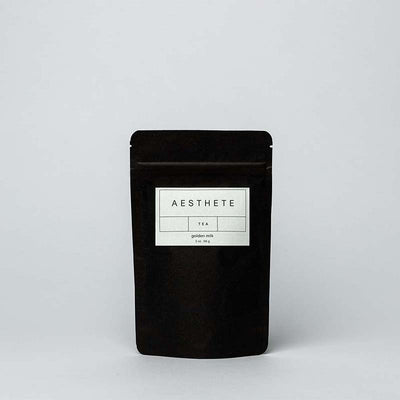 Golden Milk Aesthete Tea packaged in black matte paper. An organic loose leaf tea and herbal blend brand based in Portland, Oregon.