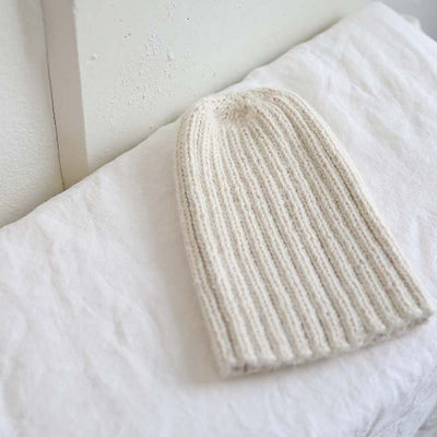 Knitted cream pampa cap by Awamaki made from alpaca wool