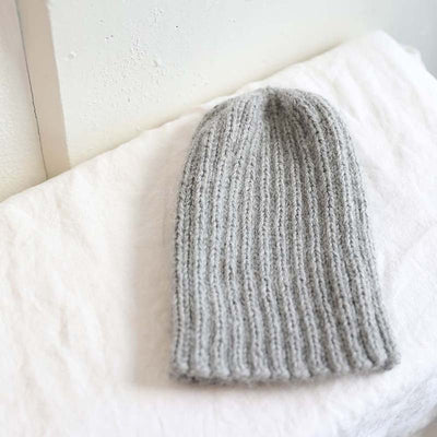 Knitted grey pampa cap by Awamaki made from alpaca wool
