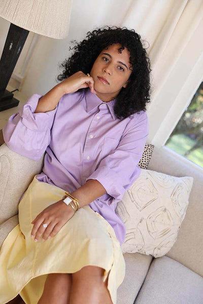Sarah our in house assistant designer wears the lavender shirtdress. Paired with Cura statement jewelry handmade in Mexico. Cura x RAI - Reimagined Boyfriend Shirtdress. Hip, sustainable, socially impactful, one-of-a-kind dress created from repurposed men shirts. Up-cycled, ethical slow fashion at its finest.