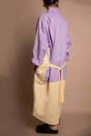 Cinch tie on the reimagined boyfriend shirt dress ethically made and designed in Seattle, Washington by Cura. The dress features a high low bottom hem.