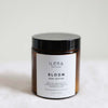 Bloom Body Butter ethically made with lavender and rose by Ilera Apothecary in amber packaging and black lid