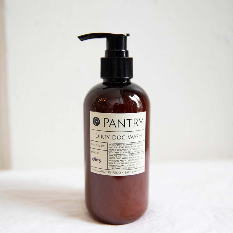 Dirty Dog Wash by Pantry Products in an amber pump bottle. Handmade in Reno. All natural ingredients like rosemarey, apple cider vinegar, honey and more.