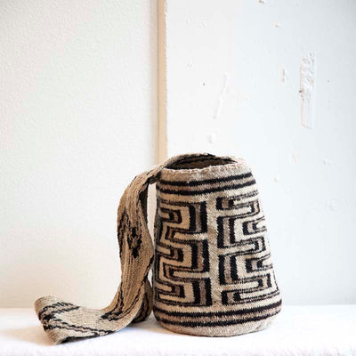 Handcrafted cross body Arhuaca Mochila Bag crochet weaved. Made from 100% virgin wool. Designed with a geometric water pattern in brown and cream tones.