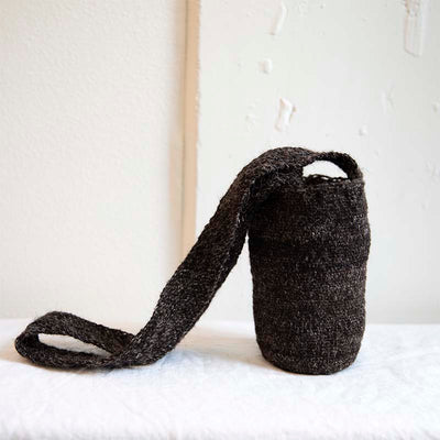 A dark brown wool bag ethically made in Colombia known as the Arhuaca Mochila Bag. Handspun from 100% virgin wool.