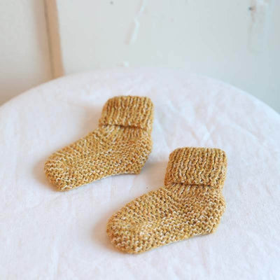 Yellow Muku Booties for ages 6-12months old hand knitted from baby alpaca yarn and pima cotton by artisans for Awamaki in Peru