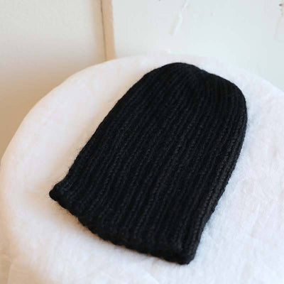 Knitted blackl pampa cap by Awamaki made from alpaca wool