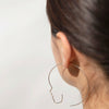 close up shot of silver cara earrings