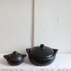 A small and large version of La Chamba Casseroles ethically made from non-toxic clay in Colombia