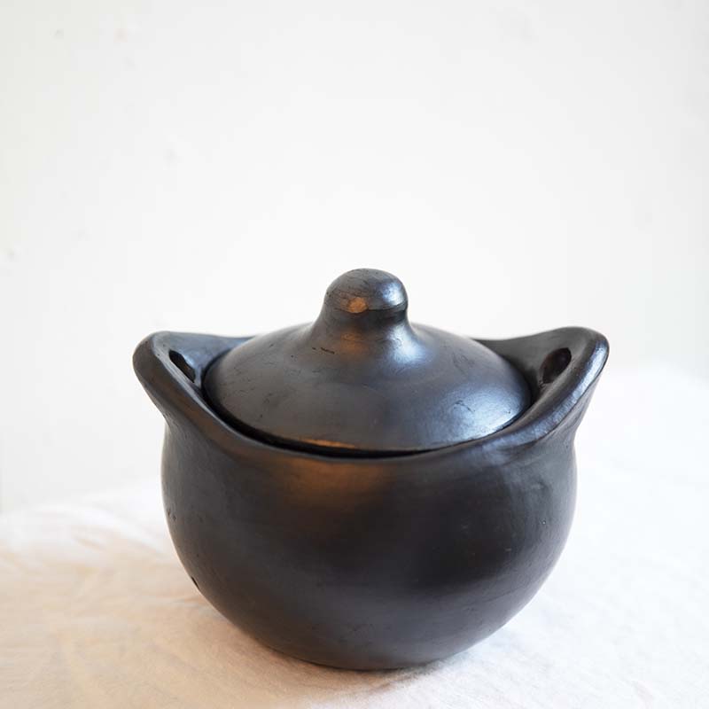 La Chamba Small soup pot made from earthenware mica clay in black. Two handles and a cover for easy cooking.