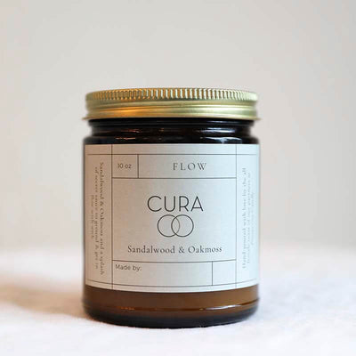 Cura Candle hand poured with notes of sandalwood and oakmoss