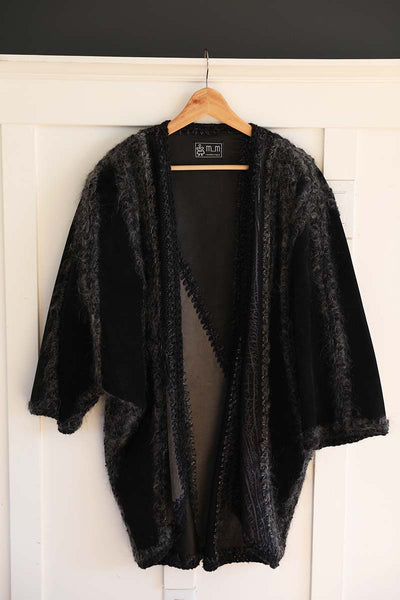 The Wool Batwing Cardigan displayed on a hanger one size fits all. Originally designed by mm Canada brand.