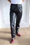 Vintage black leather pants mid waist fit, jean like pockets.