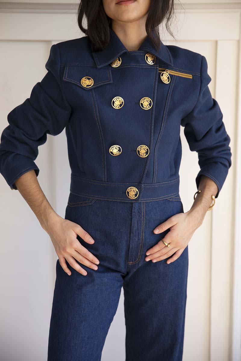 Vintage Italian Cropped jacket in a navy blue color with gold accented buttons. Made in Italy. True wool.