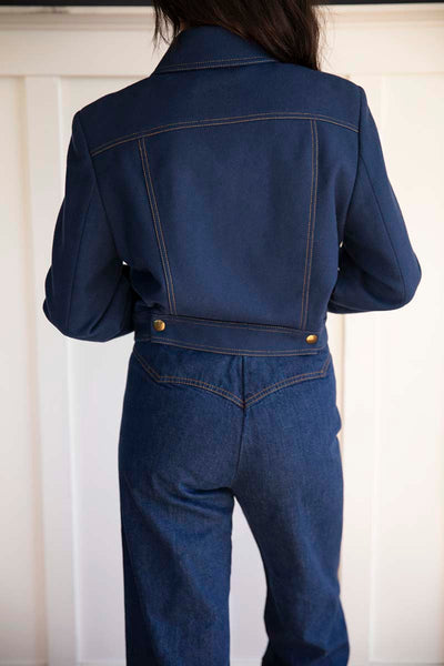 Back view of the Vintage Italian Cropped Jacket mindfully sourced for Cura Found. Has two gold accent buttons on the back. Structured to perfection.