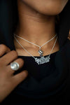 This Matters BLM Power Pendant layered with the Say Their Names Necklace both in sterling silver on a 20" inch chain