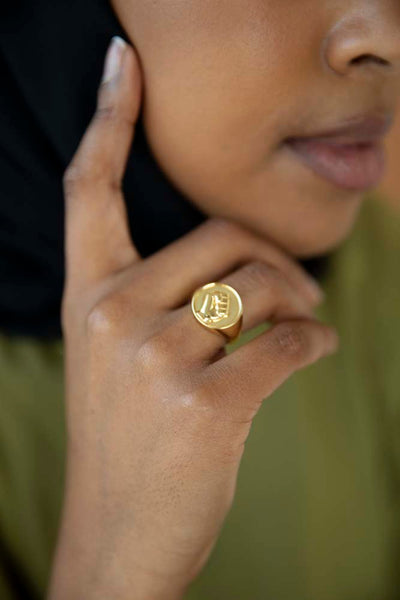 Signet gold ring with an embossed fist in solidarity with the Black Lives Matter movement