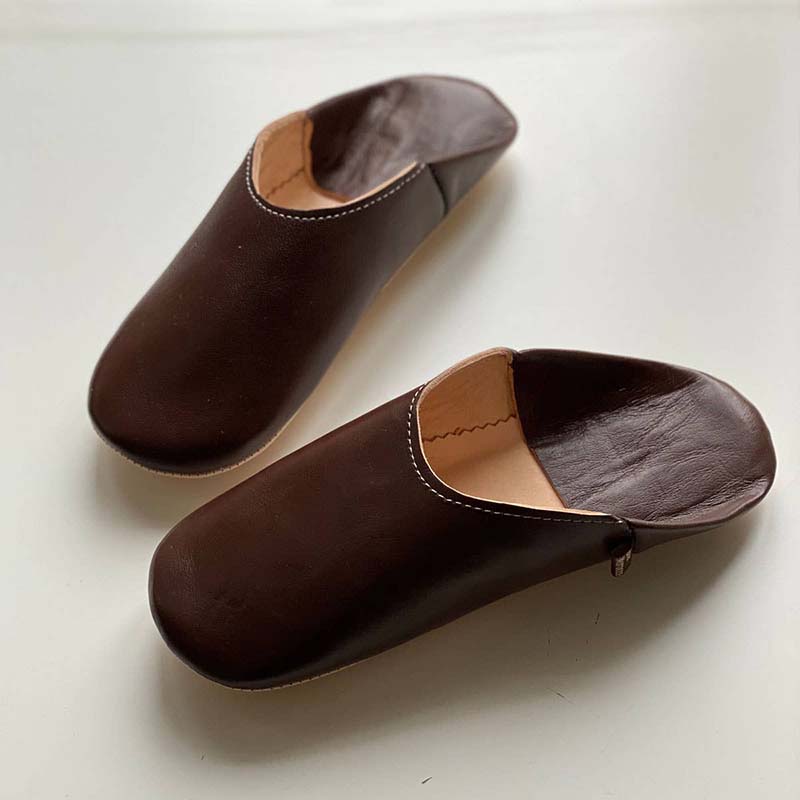 Chocolate brown babouche slippers handmade from sheepskin leather. Natural sole and hand stitched by craftsmen for Dear Morocco
