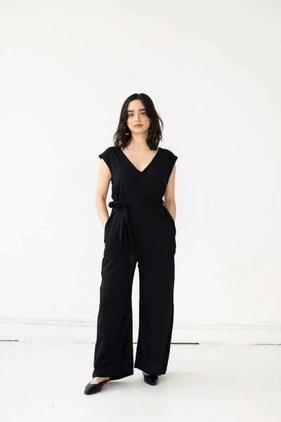 Cristina wears the Domoto jumpsuit by Cura in black. Ethically made in Cambodia