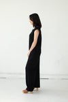 Side view of Cristina wearing the Domoto jumpsuit by Cura in black. Ethically made in Cambodia