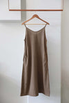 Simple slip dress in brown plant dyed with sticks by members of the Goel Community in Cambodia