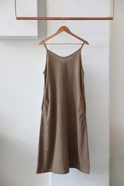 Simple slip dress in brown plant dyed with sticks by members of the Goel Community in Cambodia