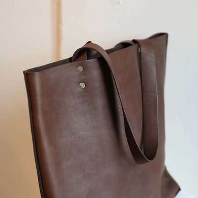 Brown leather shoulder straps on brown tote by Haiti Design Co