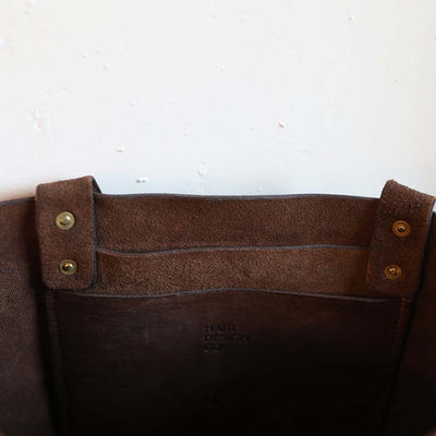 Interior pocket of tote back made from 100% ethically sourced leather perfect for placing your phone lip balm or a tiny notebook