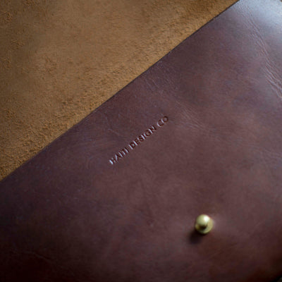 Haiti Design Co emboss logo on beautiful leather clutch