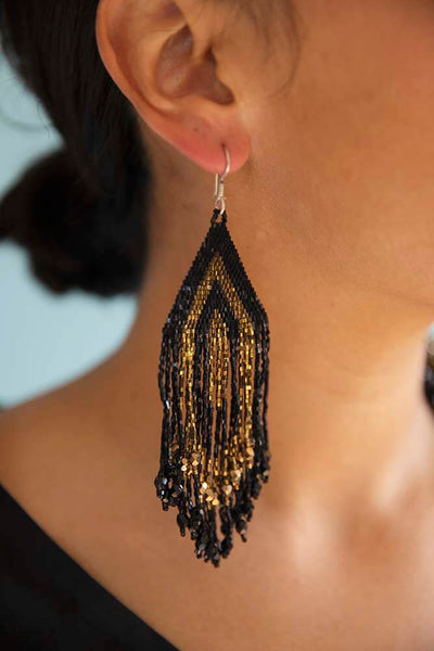 Beautiful black Japanese crystal beads mixed with gold beads intricately hand formed by the indigenous Wixáika  artisans in Mexico