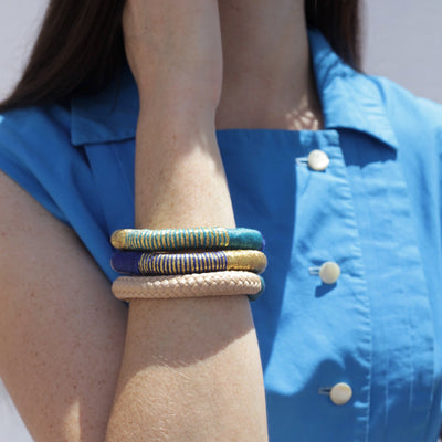 3 sets of rope bracelet on woman's wrist