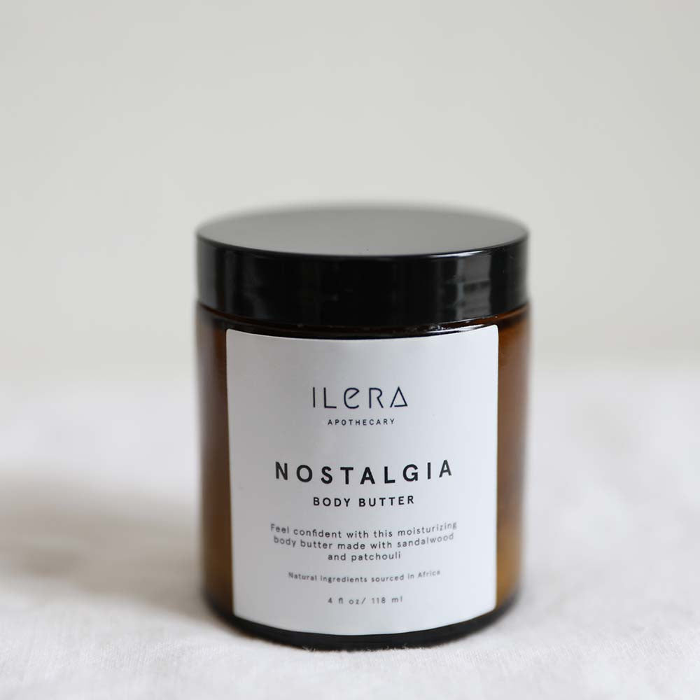 Nostalgia Body Butter ethically made with sandalwood and patchouli by Ilera Apothecary in amber packaging and black lid