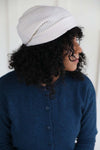 Side view of the white slouched beanie ethically made in Zhangjiagang