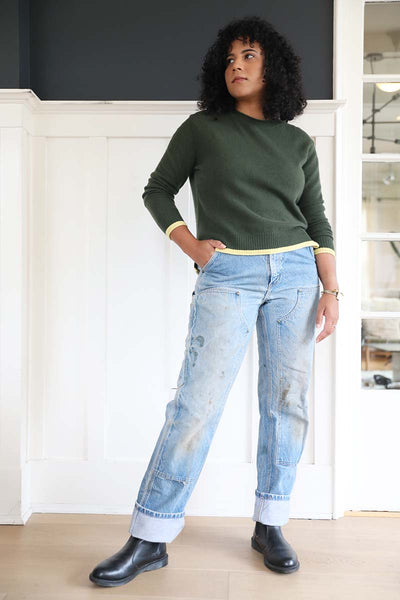 Sarah wears the green cashmere crewneck paired with vintage denim and black dr martens.