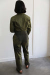 Back view of the Kiko Romeo Jumpsuit with a high waist, dip dyed pattern in green and black on the straight fit legs