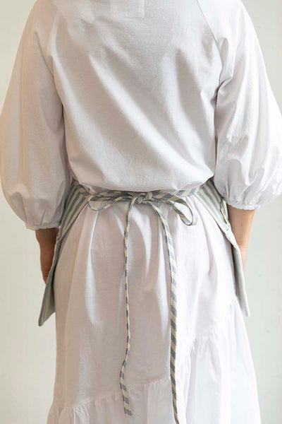 Back view of the Striped Waist Apron by Meema ethically made in Guatemala. This apron is ideal for servers, gardeners, stylists, cooks, and makers of all kinds.