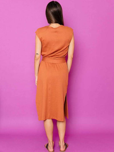 Back view of the Sasha Shift Dress color is sandstone close to orange. Rib knit texture. Ethically made for Mata Traders.