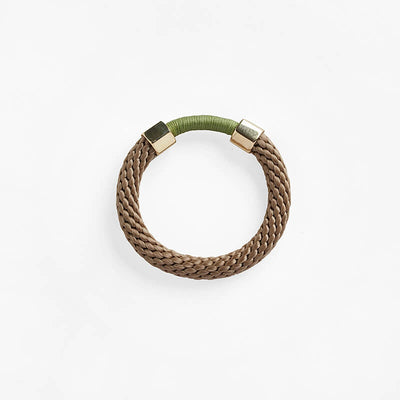 Pichulik brass Aruba bracelet in brown and olive green. Thin rope assembled with brass caps and embellished with wax cord.