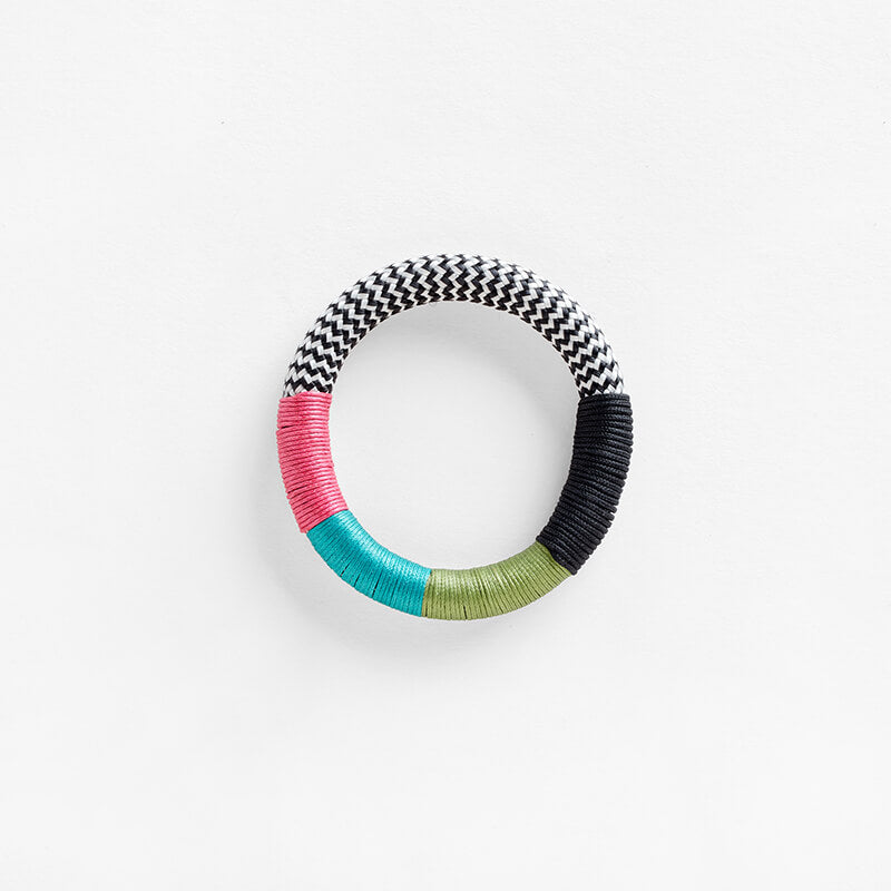 Pichulik Dynamic Bracelet in white zig zag, pink, aqua and fern colors. Loop-style rope configurations in woven static and dynamic rope, embellished with contrast wrapping 
