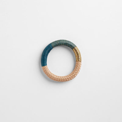 Handbraided rope bracelet in beige, teal and gold. mbellished with wax cotton and gold lurex thread. Ethically made in Cape Town, South Africa.