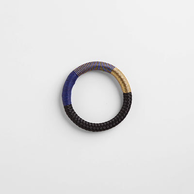 Handbraided rope bracelet in black, navy blue and gold. Embellished with wax cotton and gold lurex thread. Ethically made in Cape Town, South Africa.