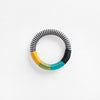 Pichulik Dynamic Bracelet in white zig zag, yellow, fern, aqua colors. Loop-style rope configurations in woven static and dynamic rope, embellished with contrast wrapping