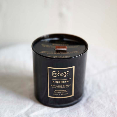 Handpoured soy blend candle with a wood wick scent is Kindness by Prosperity Candles
