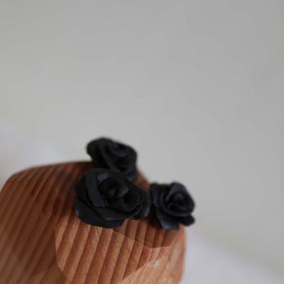 Polymer resin black roses handmade by Side Yard multi-hyphenate artist from Seattle