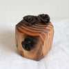 Three brown roses handmade from polymer resin by local artist Side Yard aka Theresa Wingert