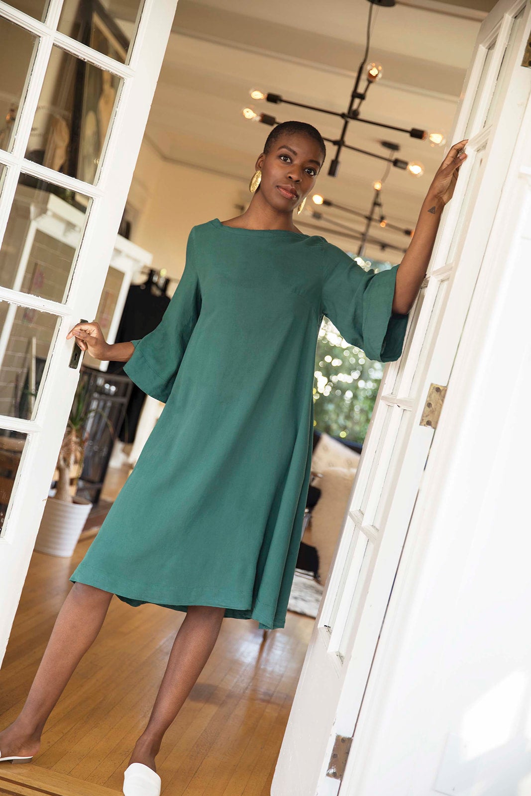 Tomoko Bell sleeve midi dress in royal green. Ethically made in Cambodia