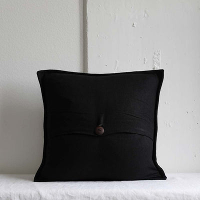 Back side of the Handwoven Black Grey Khaki Blended Stripe Pillowcase featuring a hand-carved wood button closure