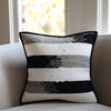 Upcycled textile scraps of the handwoven black grey khaki blended stripe pillowcase by Tonlé ethically made in Cambodia.
