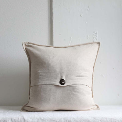 Back side of the handwoven Natural Small Stripes Pillowcase with a hand-carved wood button closure