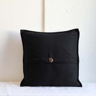 Hand-carved wood button closure featured on the Zig Zag pillowcase ethically made by Tonle